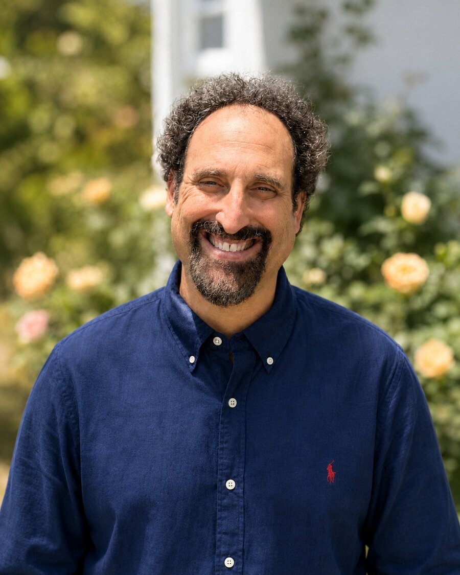 Josh Perry, M.Ed., smiling outdoors.
